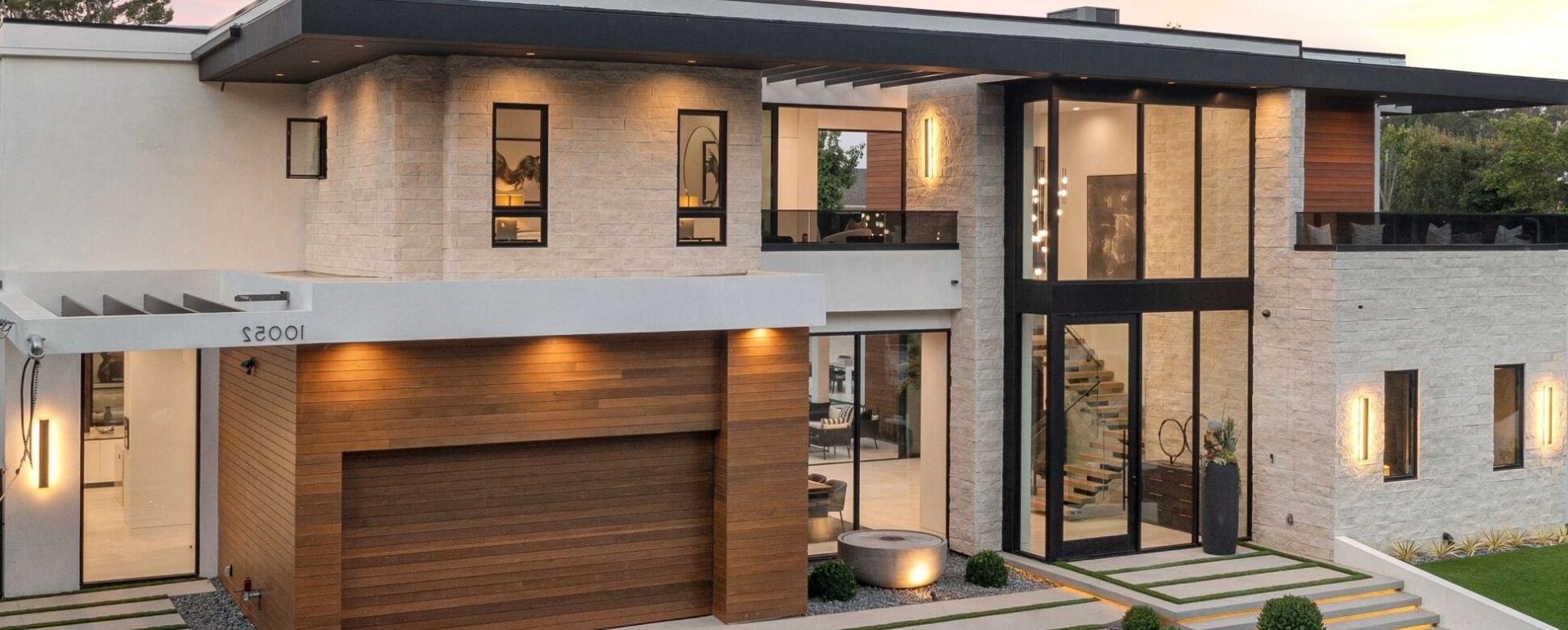 Doors windows front view of house with beautiful lights image scaled